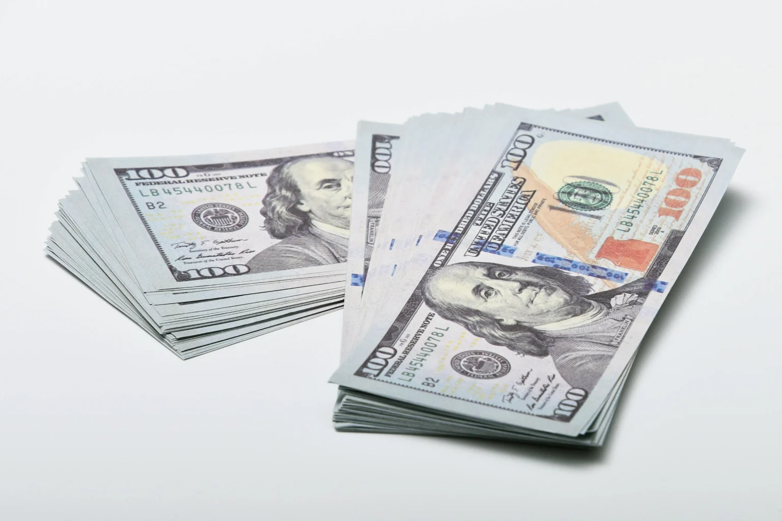 Explain why international trade requires a system for exchanging currency